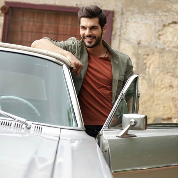 Tolga Mendi with car