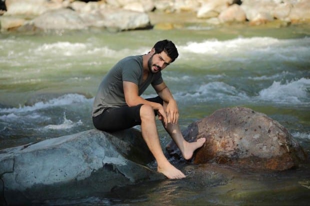 Tolga Mendi in river